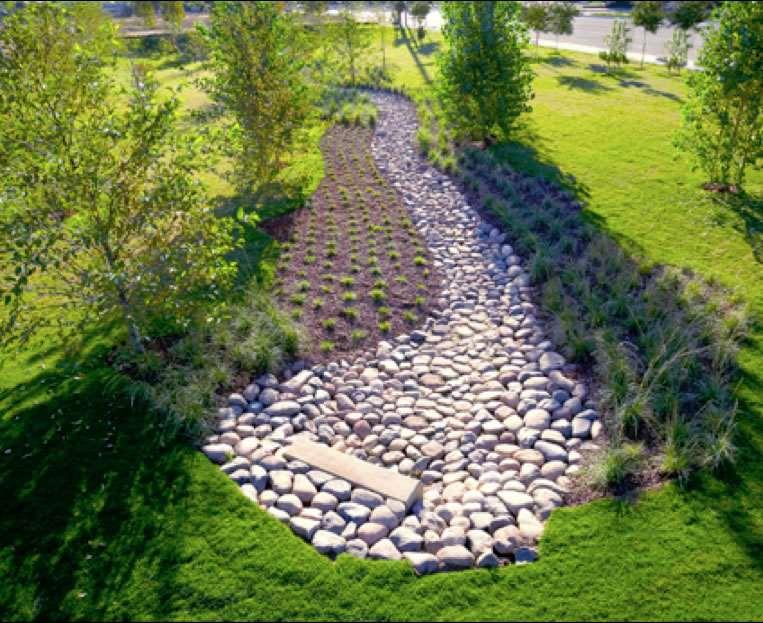 Simple planting plan incorporating: stone, mass plantings of grasses, and