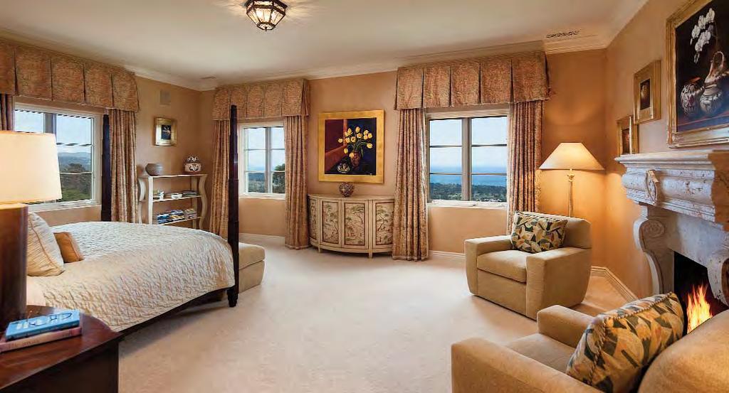MASTER BEDROOM SUITE: Sitting Room (24' x 12'): Arched double door entry opens to the expansive Sitting Room with arched double French door with a wrought-iron balcony and two windows, all