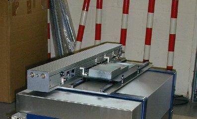 The shielded detector/collimator trolley of the WTAS is shown in position underneath the Sort Cell in Figure 3.