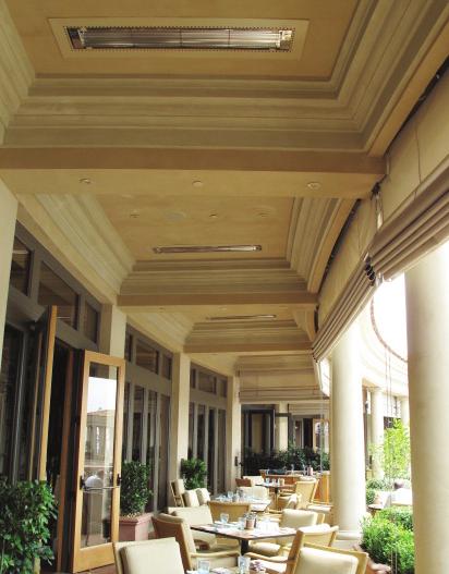 Luxury resort dining area with W-Series heaters flush mounted into a stucco coffered ceiling Casino valet station with W-Series heaters wall mounted to a