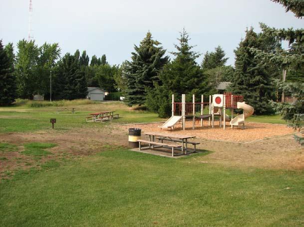 There is a small area on the northwest corner that has play equipment and picnic tables. The facility is in poor to fair condition and is for active recreational use.