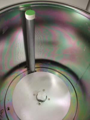 NOTE: Scratches on the interior surface will prevent a good vacuum seal. 7.1.3 Remove the loading fixture from the chamber (see Figure 6, Removing Loading Fixture). 7.2 