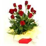 0 Boxed Rose Arrangement A bouquet of 12 beautiful red roses and foliage arranged in a funky cardboard posy box, with a cushion of complimenting coloured tissue and