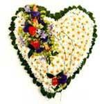 D55.0 Sympathy Heart A heart shaped tribute made of Chrysanthemums pinned into a camellia leaf lined Styrofoam base with a block of floral