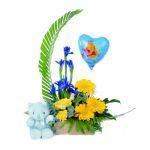 0 Arrangement with Soft Toy An asymmetric almost crescent shaped arrangement of Gerberas, spray Carnations, Molucca Balm, Tulips and Freesias