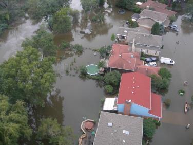 Flood-Prone Property Acquisition Program Policy adopted by Board of Commissioners on August 7, 2014 Three Distinct