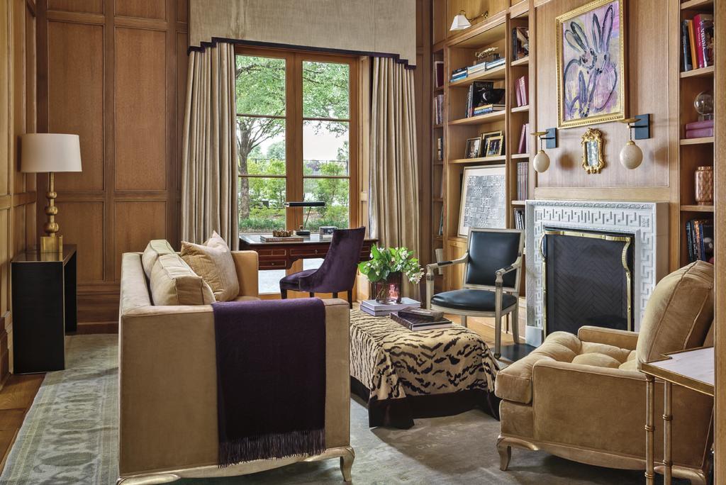 The study features custom furniture Delmonico sofa, Nancy Corzine armchair, and an ottoman in Old