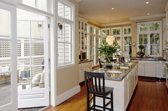 floors, parquet floors, floor to ceiling leaded glass bay windows, dentil moldings, picture wall moldings, garden outlook and two sets of French doors that open out to two small balconies.