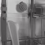 NOTE: When pushing the top rack into the dishwasher, push it until it stops against the back of the tub so the top rack spray arm will connect to the water supply.