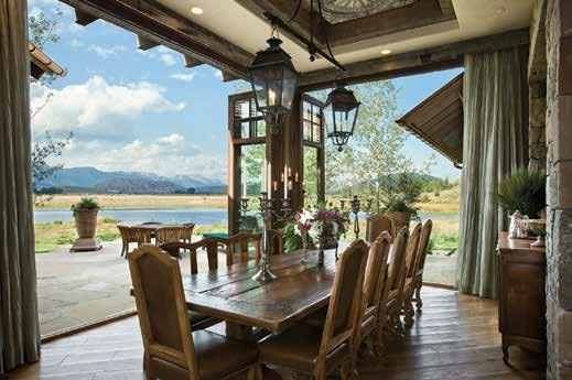 On beautiful evenings the doors off the dining room and kitchen area fold open to the patio. Above the dining table, antique lanterns were retrofitted to create a custom light fixture.