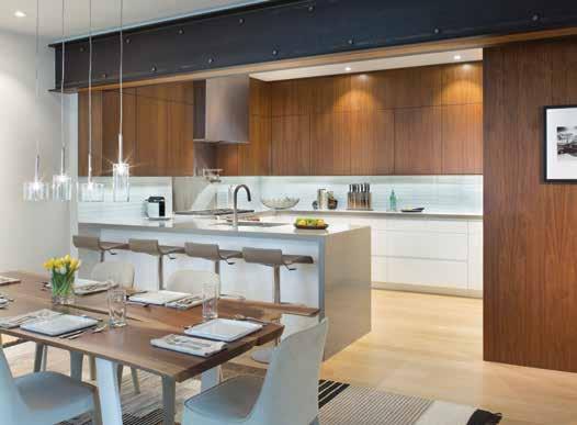 A CLEAN, WELL-LIGHTED PLACE A reconfiguration of the kitchen resulted in ample storage space paired with a linear modern palette.