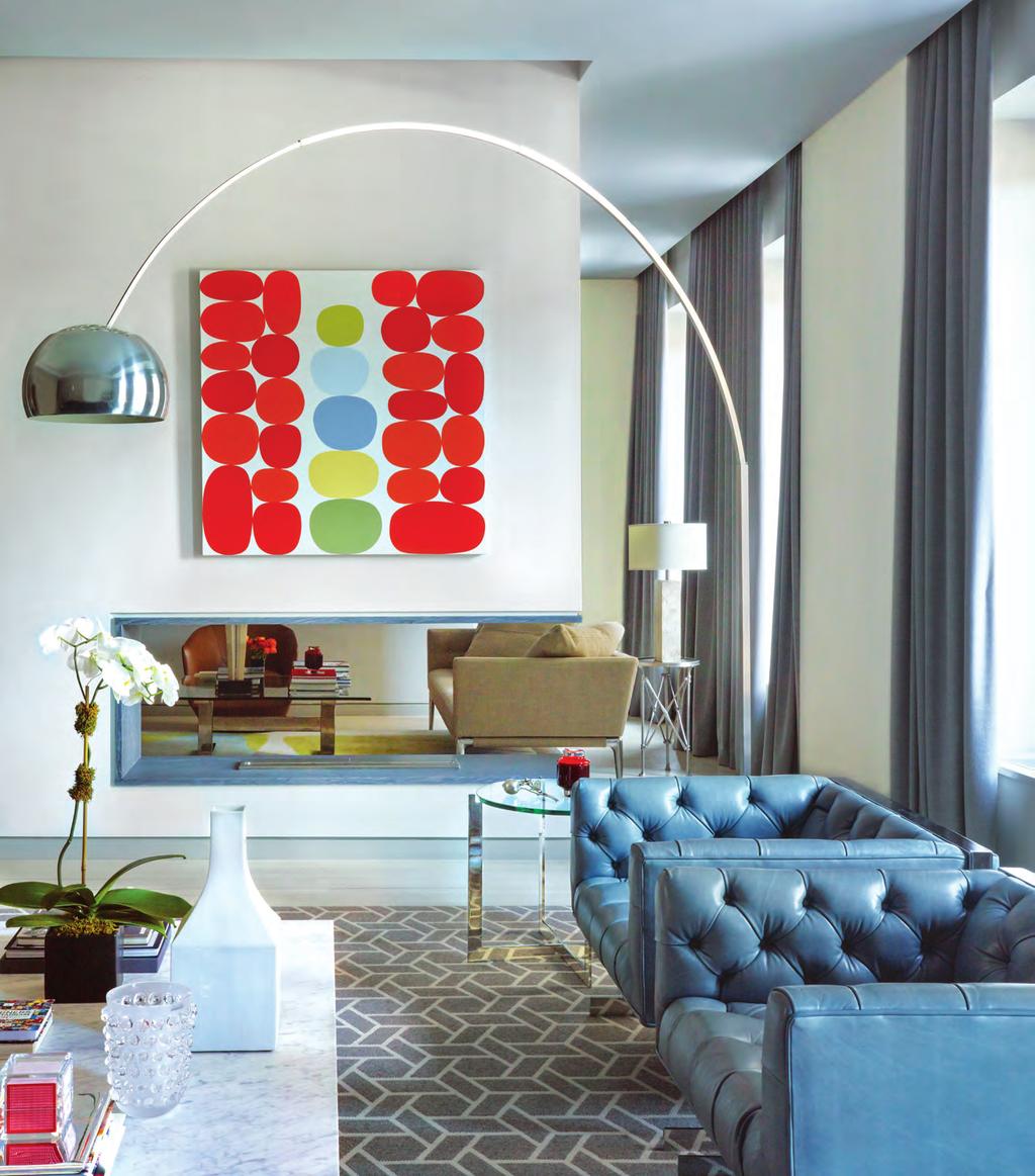 (opposite) An Arco lamp by Achille and Pier Giacomo Castiglioni frames a Warren Isensee painting in the adjacent living