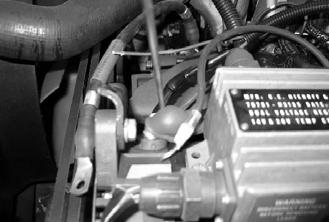 HMMWV Coolant Heater CAUTION Ensure heater control harness is clear of moving parts (e.g. steering mechanism). Route heater control harness to timer harness area and cut to length.