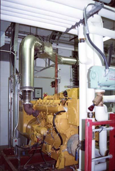 Heat from the HTCC is transferred to the building hot water heating (HWH) system via a plate-frame heat exchanger (HX-1).
