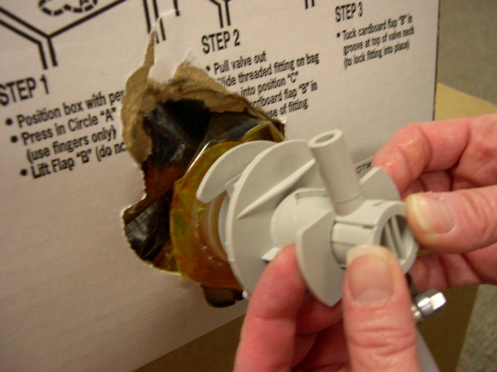 White Insert Bag Nozzle with Gray Hose Connector 2.