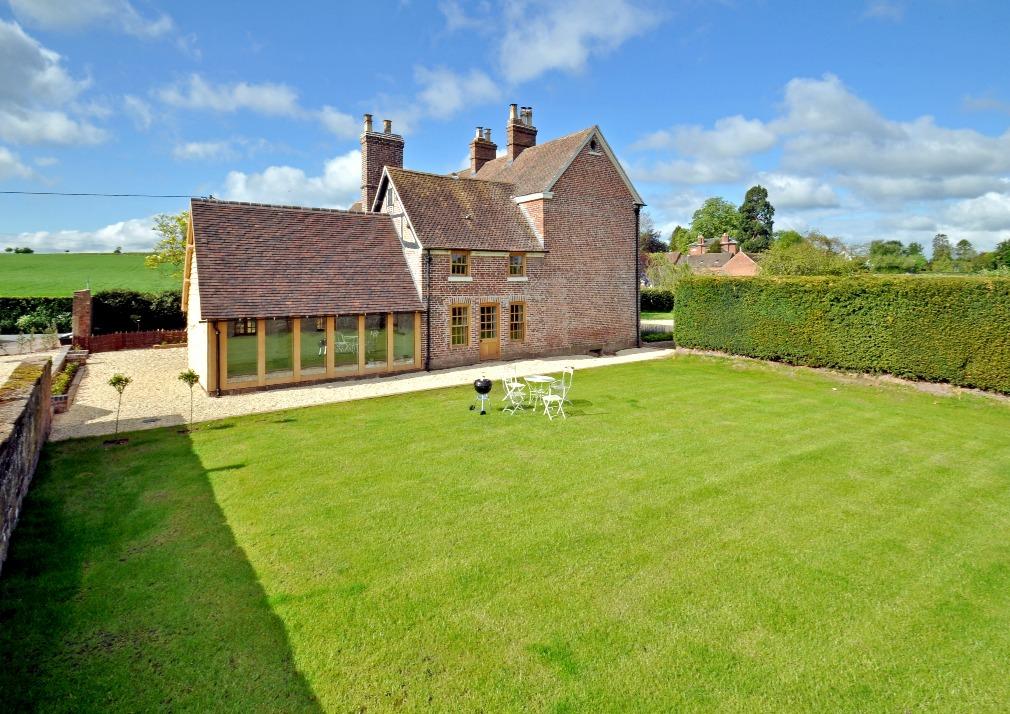 There are beautiful lawns to the front and side of the house with stunning views over adjoining Shropshire countryside and to
