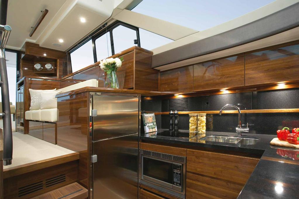 A fully equipped open plan galley is located at the port side, an