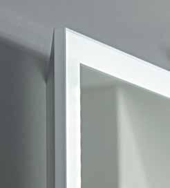 above room temperature, keeping the central area of the mirror clear.