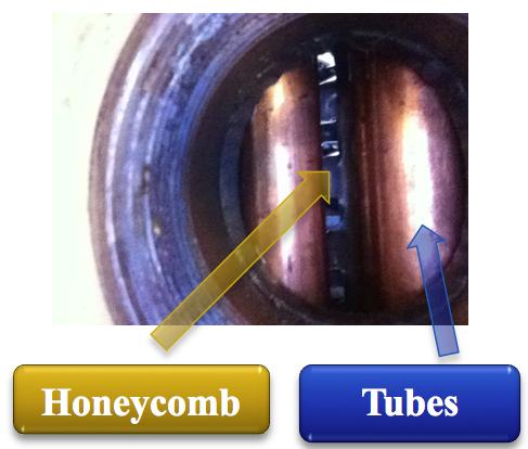 heat exchanger. So to make the tubes and honeycombs fit inside the shell the honeycomb sheet was placed in-between the spacing of the inflow tubes as can be seen in Figure 12. Figure 10.