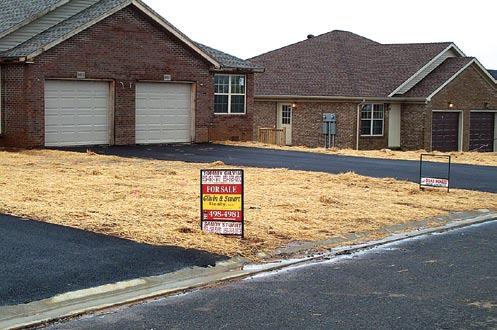 Excellent application of hand-scattered straw mulch in new residential subdivision.