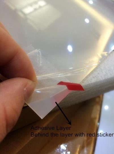 adhesive side. Be sure that no dust falls onto the adhesive side during this step.