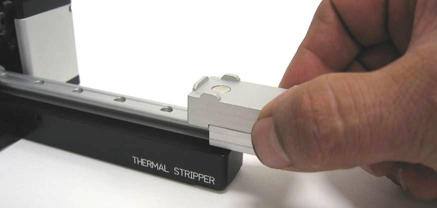At the end of the Thermal Stripper where you removed the screw slide your fiber