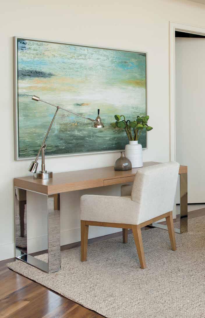 Against one wall of the downstairs bedroom, the designer kept within the same muted palette as the rest of the residence and paired a custom chair covered with a Great Plains fabric with an