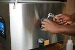 Fill the pump with oil - Insert the spout into the open hole (oil fill bolt opening) and