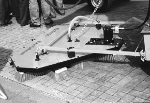 Mechanical installation machines have broom attachments that sweep the joint sand into the joints of pavers (Figure 19). These are much more efficient than using push brooms. Figure 20.