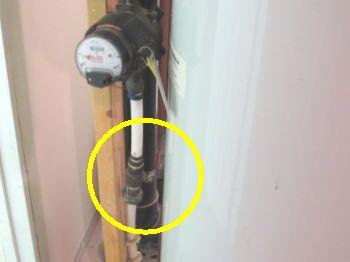 Building Plumbing Service. 1. Water Meter Location & Condition. The water meter & main water shut - off is located near the hot water tank.