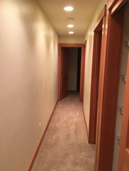 1. Conditions Basement Hallway Ceiling and walls are in good condition overall.