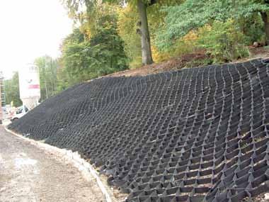 The geocell is fabricated using a geotextile so it is permeable and allows water to flow between cells encouraging drainage and vegetation.