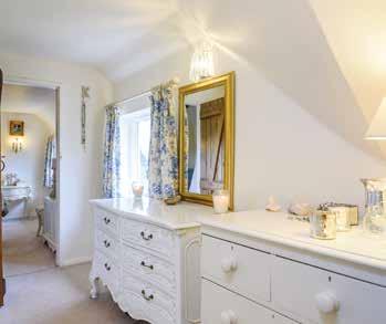 MASTER SUITE, this is a truly delightful, uplifting space with window overlooking rear garden and views, built in double wardrobes flowing through in to DRESSING AREA with three