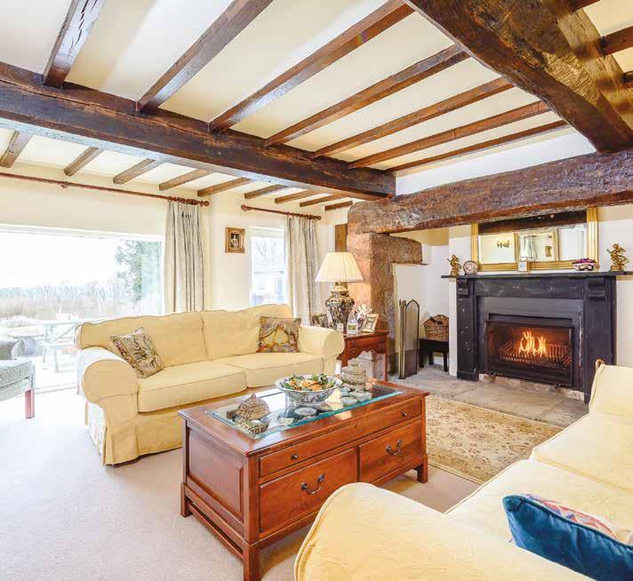 Flowing via a double set of wooden doors in to the delightful SITTING ROOM, once again bright, light and spacious, with open