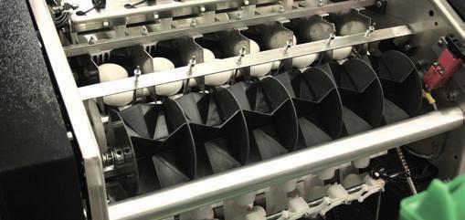 The keypad and display of the Diamond 100 FPX allow the operator to select different tray settings from the tray library. The display shows machine speed and number of eggs packed.