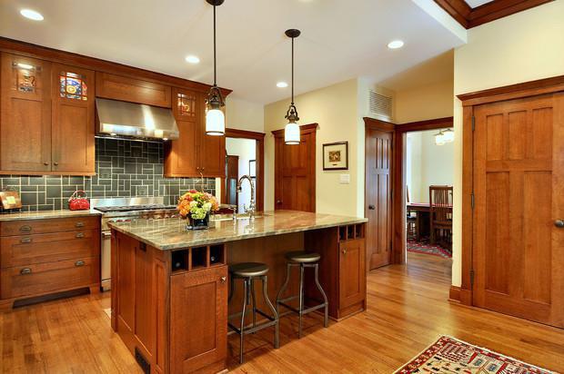In this Craftsman kitchen, notice the detail in the crown molding both over the