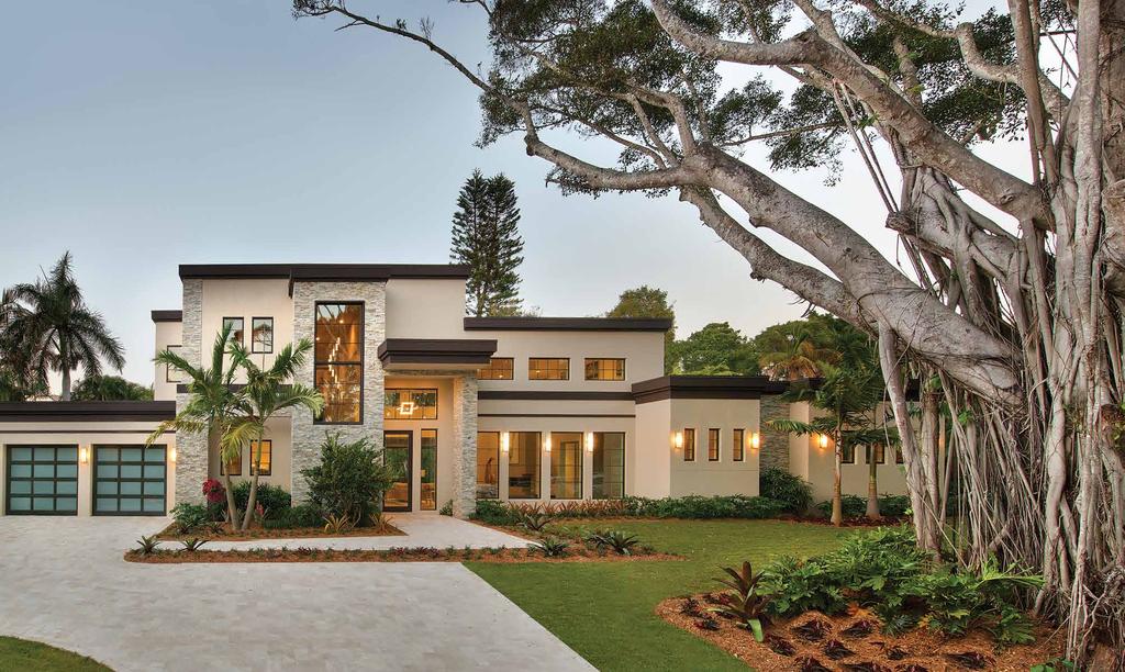A CONTEMPORARY RESIDENCE FITS RIGHT IN THE NEIGHBORHOOD A spectacular native Banyan tree frames the entrance with