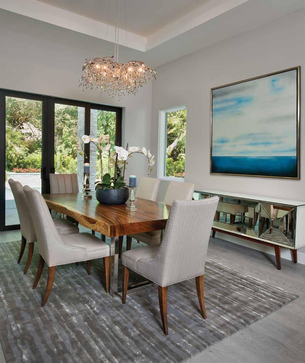 The large 75 x 75 oil on canvas titled Miles Away by Marc Johnson, artist and owner of Rothlynn Fine Art FL adorns the dining room wall.