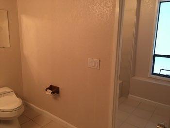 1. Location Materials: Basement Hallway Basement Bathroom 2. Room Ceiling and walls are in good condition overall.