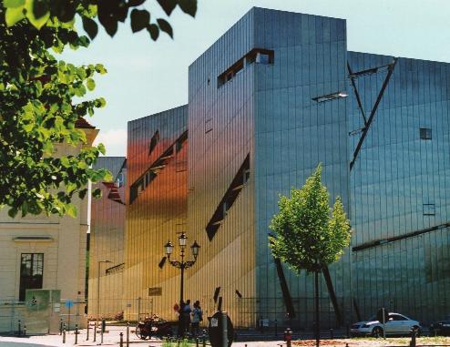 The Berlin Jewish Museum uses a combination of educational exhibitions and architectural symbolism to remind us of the violence committed against the Jews, which was