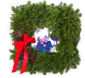 00 WRE 07 Cross Wreath Our exquisite Cross arrangement features natural pinecones, clusters of berries, a red velvet bow,
