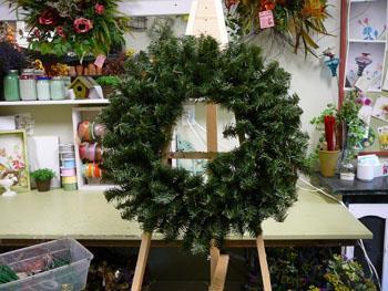 Start with one section and work your way around the wreath. Pull each stem away from the wreath base so that they are no longer lying flat.