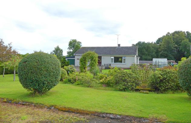 This beautifully appointed detached Bungalow sits in a quiet spot within splendid landscaped garden grounds, overlooking the surrounding countryside.