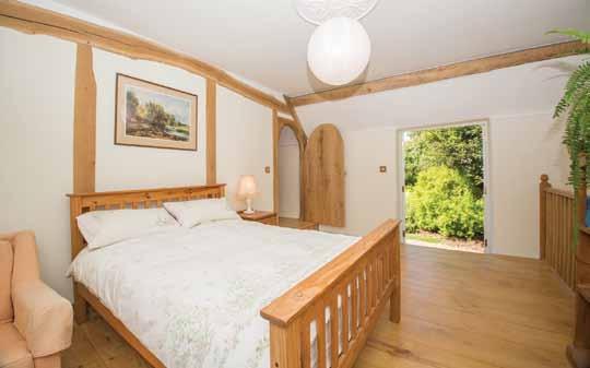 The layout of the accommodation is based on a typical longhouse and therefore offers a crosspassage entrance hall featuring a splendid dressed granite wall with plinth and cornice to one side and oak