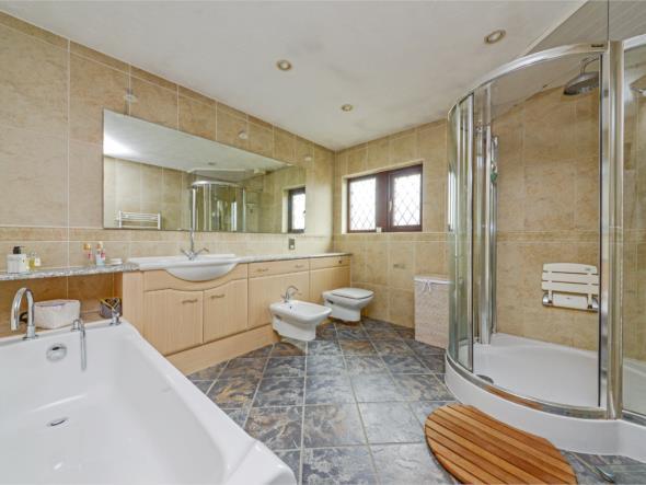 EN-SUITE BATHROOM 10'10'' X 10' (330m X 305m ) As the dimensions indicate this is a spacious en-suite which has diamond leaded and frosted PVCu double glazed windows There are inset ceiling