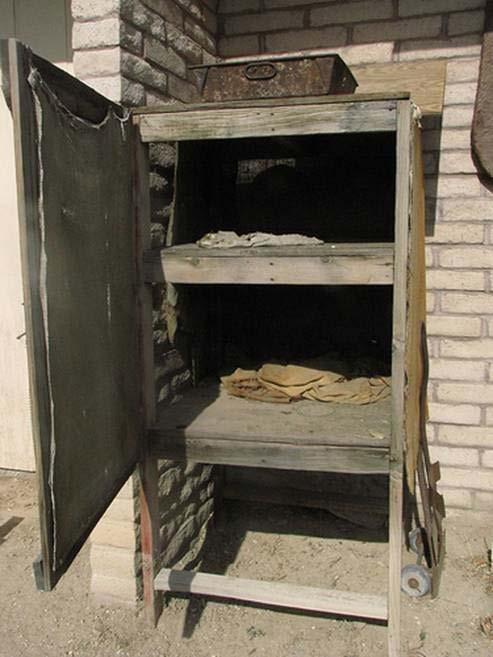 This was one of the first built-in refrigerators, circa 1900, Fresno, CA. Evaporative cooling technology was also utilized early on to cool automobiles.