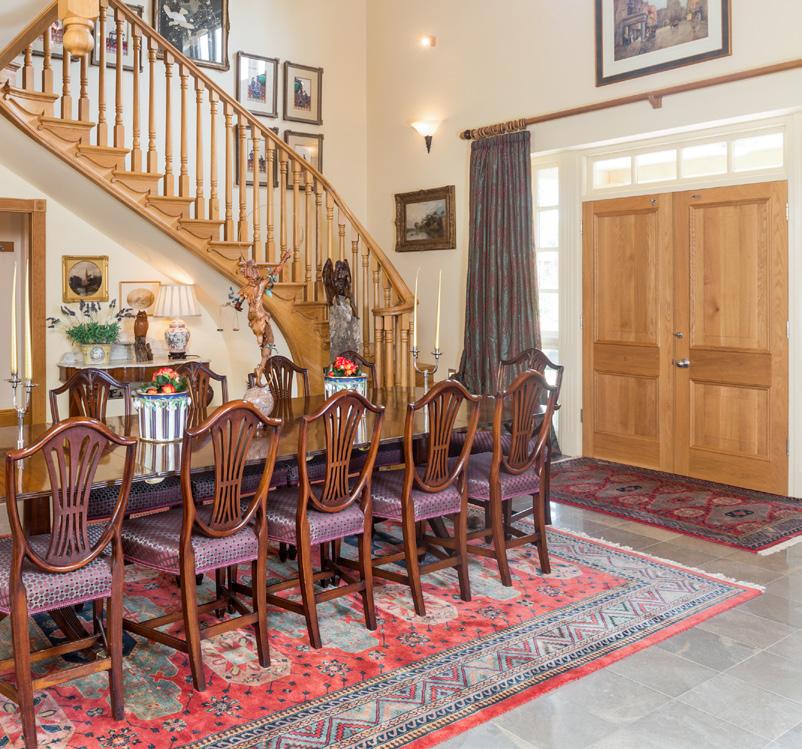 Ground Floor The house focuses around a dramatic full height galleried reception hallway with open plan dining room and magnificent quarter turning staircase rising to the first floor landing.