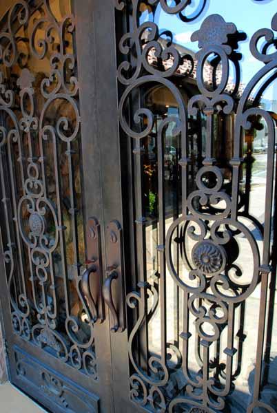 Envision the exquisite hand forged beauty of wrought iron doors dramatically transforming the entrance to your home. Enhance your home's curb appeal and increase its value immediately.