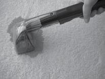 3. Set tool on stain and press the trigger to spray solution onto the area to be cleaned. 4.