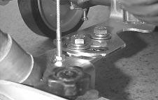 To adjust pad pressure, turn adjustment knob counterclockwise to decrease or clockwise to increase pressure. Adjustment knob is located below brush lift pedal (Figure 24). FIG.